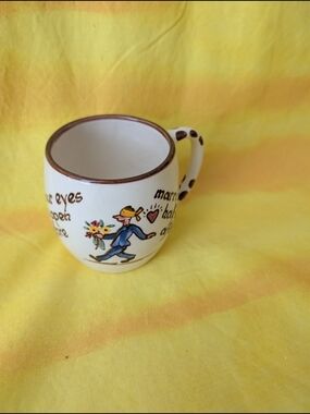 Hand-Painted Cream Ceramic Mug with Brown Trim and Colorful Illustration